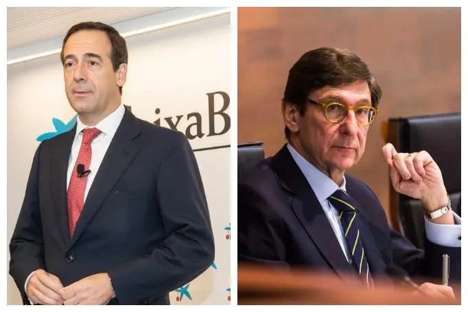 Gonzalo Gort&aacute;zar, consejero delegado de CaixaBank (izq) y Jos&eacute; Ignacio Goirigolzarri, presidente de Bankia (der). - ep