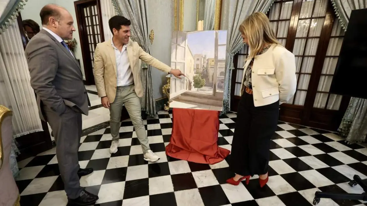 Eduardo Mill&aacute;n con el cuadro con motivo del 19 de Marzo en Diputaci&oacute;n. - VIVA
